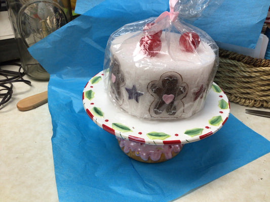 Cake stand with gingerbread candle cake